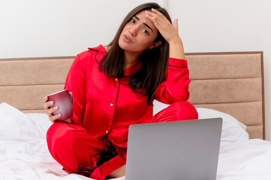 beautiful-woman-red-pajamas-sitting-bed-burnout-morocco