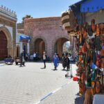 Expats exploring a colorful medina street during their first weeks of moving to Morocco