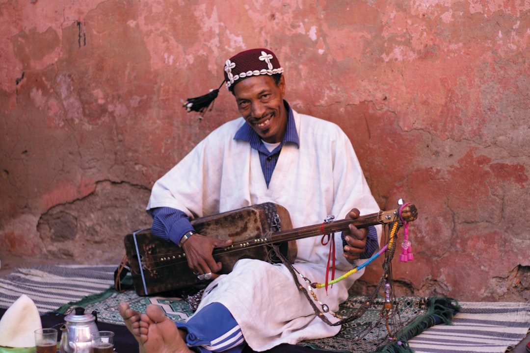 A maalem performs for a large crowd at the Gnaoua festival in Essaouira, Morocco