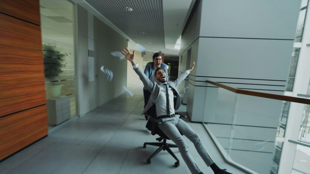 Woman practising breathing techniques in a quiet office hallway before a meeting